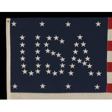 48 STARS CONFIGURED INTO THE LETTERS “U.S.A.”, COPYRIGHTED IN 1916 BY C.A. HARTMAN, ONE OF ONLY FOUR KNOWN SURVIVING EXAMPLES AND ONE OF THE MOST INTERESTING DESIGNS KNOWN TO EXIST IN EARLY FLAGS