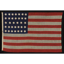 34 STARS ON AN ANTIQUE AMERICAN FLAG OF THE CIVIL WAR PERIOD, MADE BY WILLIAM G. MINTZER IN PHILADELPHIA, PENNSYLVANIA, 1861-63, REFLECTS KANSAS STATEHOOD