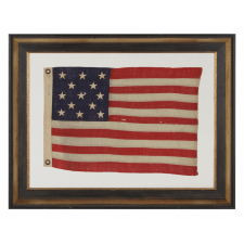 13 STARS ARRANGED IN A 3-2-3-2-3 LINEAL CONFIGURATION ON AN TINY ANTIQUE AMERICAN FLAG AMONG ITS COUNTERPARTS WITH PIECED-AND-SEWN CONSTRUCTION, ca 1895-1920's, MADE BY THE ANNIN COMPANY OF NEW YORK & NEW JERSEY
