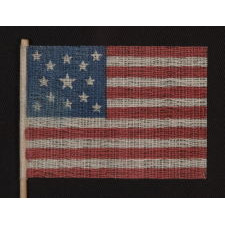 13 STARS IN A MEDALLION PATTERN ON AN ANTIQUE AMERICAN FLAG MADE FOR THE 1876 CENTENNIAL CELEBRATION