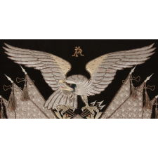 ELABORATE SAILOR’S SOUVENIR EMBROIDERY FROM THE ORIENT WITH A LARGE FEDERAL EAGLE, CROSSED FLAGS, CANNON AND ANCHOR, OBTAINED IN YOKOHAMA, JAPAN, DATED 1906