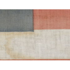35 STARS IN A NOTCHED PATTERN ON A FLAG MADE FOR THE 1864 PRESIDENTIAL CAMPAIGN OF ABRAHAM LINCOLN & ANDREW JOHNSON; A MONUMENTAL EXAMPLE AND THE SECOND TO THE LARGEST KNOWN AMONG ALL CAMPAIGN PARADE FLAGS OF THE 19TH CENTURY, ACROSS ALL ELECTIONS