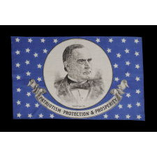 SILK PARADE FLAG WITH 46 STARS ON A STRIKING, ROYAL BLUE GROUND, MADE FOR THE 1900 PRESIDENTIAL CAMPAIGN OF WILLIAM McKINLEY, FEATURING A LARGE PORTRAIT AND A GREAT SLOGAN