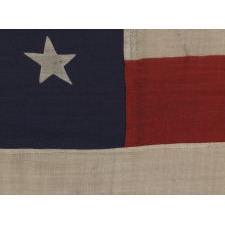 38 STARS IN A "NOTCHED" PATTERN ON A CLAMP-DYED AMERICAN FLAG OF THE 1876-1889 PERIOD, REFLECTS COLORADO STATEHOOD, MADE BY THE U.S. BUNTING COMPANY IN LOWELL, MASSACHUSETTS