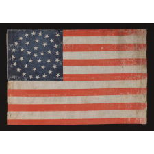 38 STARS IN A BEAUTIFUL MEDALLION CONFIGURATION WITH 2 OUTLIERS, ON A LARGE SCALE ANTIQUE AMERICAN PARADE FLAG OF THE 1876-1889 ERA, COLORADO STATEHOOD