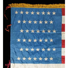 43 STARS, IDAHO STATEHOOD, ONE OF THE RAREST STAR COUNTS AMONG SURVIVING AMERICAN FLAGS OF THE 19TH CENTURY; AN EXCEPTIONALLY RARE U.S. INFANTRY BATTLE FLAG, ENTIRELY HAND-SEWN, MADE FOR AN AFRICAN-AMERICAN UNIT OF CIVIL WAR ORIGIN, CA 1889