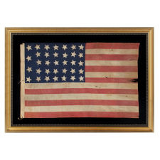 34 STARS, AN ENTIRELY HAND-SEWN CIVIL WAR PERIOD FLAG IN AN EXTRAORDINARY SMALL SIZE FOR THE PERIOD, 1861-63, KANSAS STATEHOOD