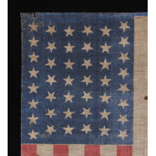 44 STARS IN DANCING ROWS IN AN HOURGLASS FORMATION, ON AN ANTIQUE AMERICAN PARADE FLAG, 1890-1896, REFLECTS WYOMING STATEHOOD