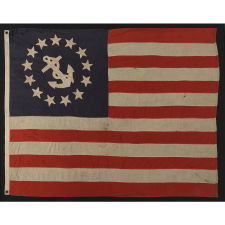 13 STAR PRIVATE YACHT FLAG, WITH HAND-SEWN, SINGLE-APPLIQUÉD STARS AND ANCHOR, MADE BY ANNIN IN NEW YORK CITY, CA 1875-1890, A GREAT, EARLY EXAMPLE AMONG SURVIVING FLAGS IN THIS FORM