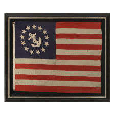 13 STAR PRIVATE YACHT FLAG, WITH HAND-SEWN, SINGLE-APPLIQUÉD STARS AND ANCHOR, MADE BY ANNIN IN NEW YORK CITY, CA 1875-1890, A GREAT, EARLY EXAMPLE AMONG SURVIVING FLAGS IN THIS FORM