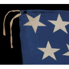 38 STARS AND A VERY UNUSUAL COMPLEMENT OF 31 STRIPES, ON AN ANTIQUE AMERICAN FLAG MADE DURING THE PERIOD WHEN COLORADO WAS THE MOST RECENT STATE TO JOIN THE UNION, 1876-1889, WITH STUNNING GRAPHICS AND COLORS, ONE-OF-A-KIND AMONG KNOWN EXAMPLES