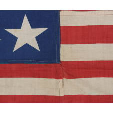 38 STARS AND A VERY UNUSUAL COMPLEMENT OF 31 STRIPES, ON AN ANTIQUE AMERICAN FLAG MADE DURING THE PERIOD WHEN COLORADO WAS THE MOST RECENT STATE TO JOIN THE UNION, 1876-1889, WITH STUNNING GRAPHICS AND COLORS, ONE-OF-A-KIND AMONG KNOWN EXAMPLES