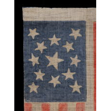 13 STARS IN A MEDALLION PATTERN ON AN ANTIQUE AMERICAN PARADE FLAG, MADE FOR THE 1876 CENTENNIAL OF AMERICAN INDEPENDENCE; A LARGE EXAMPLE AMONG ITS COUNTERPARTS OF THE PERIOD