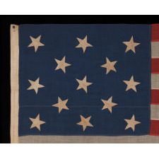 13 HAND-SEWN STARS IN A 3-2-3-2-3 PATTERN ON AN ANTIQUE AMERICAN FLAG OF THE 1876 CENTENNIAL ERA, POSSIBLY A U.S. NAVY SMALL BOAT ENSIGN
