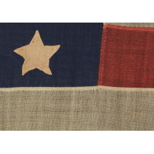 37 SINGLE APPLIQUÉD STARS ON AN ANTIQUE AMERICAN FLAG MADE DURING THE RECONSTRUCTION ERA, DURING THE INDIAN WARS, BETWEEN 1867-1876, WHEN NEBRASKA WAS THE MOST RECENT STATE TO JOIN THE UNION