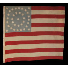 36 EIGHT-POINTED STARS IN MEDALLION CONFIGURATION, ON AN OCEAN BLUE CANTON THAT RESTS ON THE WAR STRIPE; A SPECTACULAR CIVIL WAR PERIOD FLAG FROM THE TINCLAD GUNBOAT "GENERAL GRANT," THAT SERVED ON THE TENNESSEE RIVER IN DEFENSE OF THE MISSISSIPPI