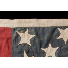 33 HAPHAZARDLY PLACED STARS AND 11 STRIPES ON AN ANTIQUE AMERICAN FLAG WITH ITS CANTON RESTING ON THE WAR STRIPE, MADE IN THE PERIOD BETWEEN 1859-1861, OREGON STATEHOOD, PRE-CIVIL WAR THROUGH THE WAR'S OPENING YEAR