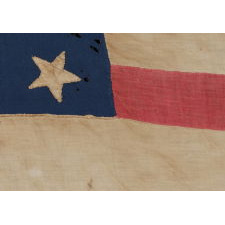 36 STARS, A HOMEMADE FLAG OF THE CIVIL WAR ERA WITH AN EXCEPTIONAL RANDOM STAR PATTERN AND GREAT DISPARITY BETWEEN THE WIDTH OF THE RED AND WHITE STRIPES, NEVADA STATEHOOD, 1864-67