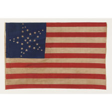 34 STARS IN 3 DIFFERENT SIZES, ARRANGED IN THE "GREAT STAR" OR "GREAT LUMINARY" PATTERN ON A LARGE SCALE CIVIL WAR PERIOD PARADE FLAG, 1861-1863, KANSAS STATEHOOD