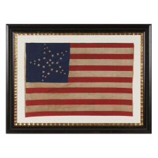 34 STARS IN 3 DIFFERENT SIZES, ARRANGED IN THE "GREAT STAR" OR "GREAT LUMINARY" PATTERN ON A LARGE SCALE CIVIL WAR PERIOD PARADE FLAG, 1861-1863, KANSAS STATEHOOD