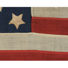 34 STARS, IN A CONFIGURATION THAT IS UNIQUE TO THIS SMALL SCALE, CIVIL WAR FLAG, WITH SUBSTANTIAL FOLK ART QUALITIES, 1861-63, KANSAS STATEHOOD