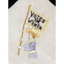 SILK HANDKERCHIEF WITH HAND-EMBROIDERED IMAGE OF A SUFFRAGETTE AND “VOTES FOR WOMEN” SLOGAN, 1910-1920