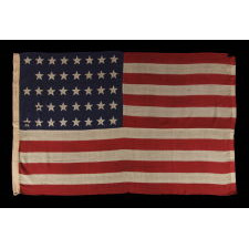 38 STAR ANTIQUE FLAG WITH A "NOTCHED" CONFIGURATION, ON A 5 ft. EXAMPLE OF THE 1876-1889 PERIOD, REFLECTS COLORADO STATEHOOD