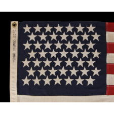 49 STARS ON A SMALL SCALE PIECED-AND-SEWN AMERICAN FLAG REFLECTING THE ADDITION OF ALASKA IN 1959, OFFICIAL FOR JUST ONE YEAR, MADE BY DETTRA IN OAKS, PENNSYLVANIA