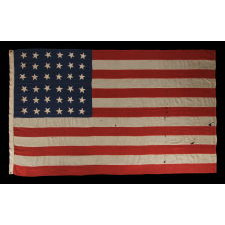 36 SINGLE-APPLIQUÉD STARS ON AN ANTIQUE AMERICAN FLAG OF THE CIVIL WAR ERA, SIGNED "J.A. STEWART," 1864-1867, NEVADA STATEHOOD