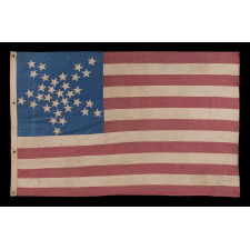 33 STARS IN A "GREAT STAR" OR "GREAT LUMINARY" PATTERN ON A HOMEMADE FLAG WITH A BEAUTIFUL, GLAZED COTTON CANTON, 1859-61, PRE-CIVIL WAR THROUGH WAR PERIOD, OREGON STATEHOOD