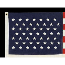 49 EMBROIDERED STARS ON A SMALL SCALE PIECED-AND-SEWN AMERICAN FLAG REFLECTING THE ADDITION OF ALASKA IN 1959, OFFICIAL FOR JUST ONE YEAR, MADE BY THE ANNIN COMPANY OF NEW YORK & NEW JERSEY