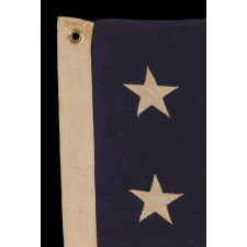 13 STARS ARRANGED IN A 3-2-3-2-3 PATTERN ON A SMALL-SCALE FLAG OF THE 1890'S-1910 ERA, WITH AN ATTRACTIVE, ELONGATED PROFILE AND AN UNUSUAL 5-FOOT LENGTH