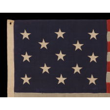 13 STARS ARRANGED IN A 3-2-3-2-3 PATTERN ON A SMALL-SCALE FLAG OF THE 1890'S-1910 ERA, WITH AN ATTRACTIVE, ELONGATED PROFILE AND AN UNUSUAL 5-FOOT LENGTH