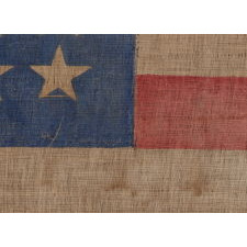 44 STAR ANTIQUE AMERICAN PARADE FLAG WITH A CORNFLOWER BLUE CANTON, ITS STARS ARRANGED IN A NOTCHED PATTERN, AND WITH A KEENLY ENDEARING PRESENTATION, 1890-1896, WYOMING STATEHOOD