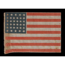 34 STARS, WITH SCATTERED POSITIONING, ON AN ANTIQUE AMERICAN PARADE FLAG MADE DURING THE OPENING TWO YEARS OF THE CIVIL WAR, 1861-63, KANSAS STATEHOOD