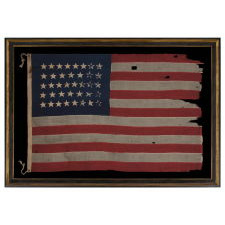 38 STAR FLAG WITH HAND-SEWN STARS IN A CONFINED PATTERN OF JUSTIFIED ROWS, ENDEARING WEAR, AND WONDERFUL PRESENTATION, 1876-1889, COLORADO STATEHOOD