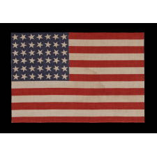 42 STARS, AN UNOFFICIAL STAR COUNT, ON AN ANTIQUE AMERICAN FLAG WITH SCATTERED STAR POSITIONING, 1889-1890, WASHINGTON STATEHOOD