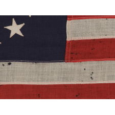 13 STARS IN THE BETSY ROSS PATTERN ON A SMALL-SCALE ANTIQUE AMERICAN FLAG OF THE 1895-1920’s ERA