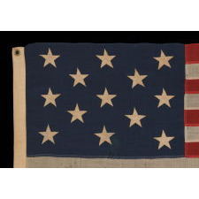 13 STARS ARRANGED IN A 3-2-3-2-3 PATTERN ON A SMALL-SCALE FLAG OF THE 1890's-1910 ERA, WITH AN ATTRACTIVE, ELONGATED PROFILE