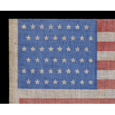 48 STARS IN STAGGERED ROWS ON AN ANTIQUE AMERICAN FLAG WITH A BRILLIANT, CORNFLOWER BLUE CANTON, MADE BETWEEN 1912 - 1918, OR PERHAPS PRIOR; REFLECTS ARIZONA & NEW MEXICO STATEHOOD