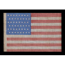 48 STARS IN STAGGERED ROWS ON AN ANTIQUE AMERICAN FLAG WITH A BRILLIANT, CORNFLOWER BLUE CANTON, MADE BETWEEN 1912 - 1918, OR PERHAPS PRIOR; REFLECTS ARIZONA & NEW MEXICO STATEHOOD