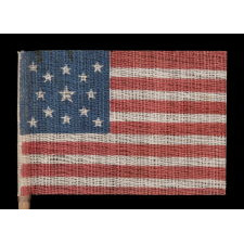 13 STARS IN A MEDALLION PATTERN ON AN ANTIQUE AMERICAN PARADE FLAG MADE FOR THE 1876 CENTENNIAL CELEBRATION