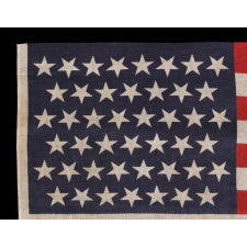 45 STARS IN LINEAR ROWS, WITH “DANCING” OR “TUMBLING” ORIENTATION, ON AN ANTIQUE AMERICAN PARADE FLAG, 1896-1908, SPANISH-AMERICAN WAR ERA, REFLECTS UTAH STATEHOOD