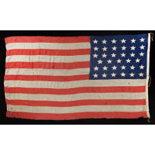 35 SINGLE-APPLIQUÉD STARS ON A CIVIL WAR PERIOD FLAG, SIGNED BY A SURGEON FROM SARATOGA SPRINGS, NEW YORK WHO SERVED WITH THE 29TH NEW YORK STATE MILITIA, WHICH MUSTERED OUT ON JUNE 20TH, 1863, THE EXACT DAY UPON WHICH WEST VIRGINIA BECAME THE 35TH STATE; OFFICIAL FROM THAT YEAR UNTIL 1865