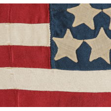23 STARS ON AN ANTIQUE AMERICAN FLAG MADE IN THE PERIOD BETWEEN 1870 AND THE 1890's; AN EXTREMELY RARE STAR COUNT, PROBABLY MADE TO COMMEMORATE THE YEAR IN WHICH MAINE ENTERED THE UNION AS THE 23rd STATE, IN 1820
