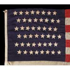 48 STARS IN STAGGERED ROWS ON AN ANTIQUE AMERICAN FLAG MADE BETWEEN 1912 AND 1918, OR PERHAPS PRIOR; REFLECTS ARIZONA & NEW MEXICO STATEHOOD