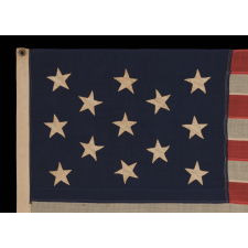 13 HAND-SEWN STARS IN A 3-2-3-2-3 PATTERN ON A U.S. NAVY SMALL BOAT ENSIGN OF THE CENTENNIAL ERA, ca 1870-1882