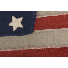 34 STARS ON A HOMEMADE AND ENTIRELY HAND-SEWN FLAG OF THE CIVIL WAR PERIOD, THE SMALLEST I HAVE EVER ENCOUNTERED AMONG PIECED-AND-SEWN WOOL EXAMPLES, AN EXTRAORDINARY FIND, 1861-63, KANSAS STATEHOOD
