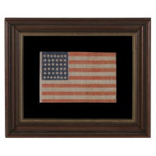 38 STAR ANTIQUE AMERICAN FLAG WITH SCATTERED STAR POSITIONING MADE DURING THE PERIOD WHEN COLORADO WAS THE MOST RECENT STATE TO JOIN THE UNION, 1876-1889