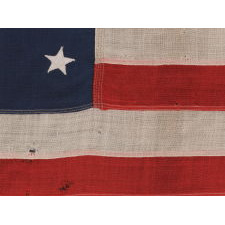 13 STARS IN A MEDALLION CONFIGURATION ON A SMALL-SCALE ANTIQUE AMERICAN FLAG OF THE 1890-1900 ERA